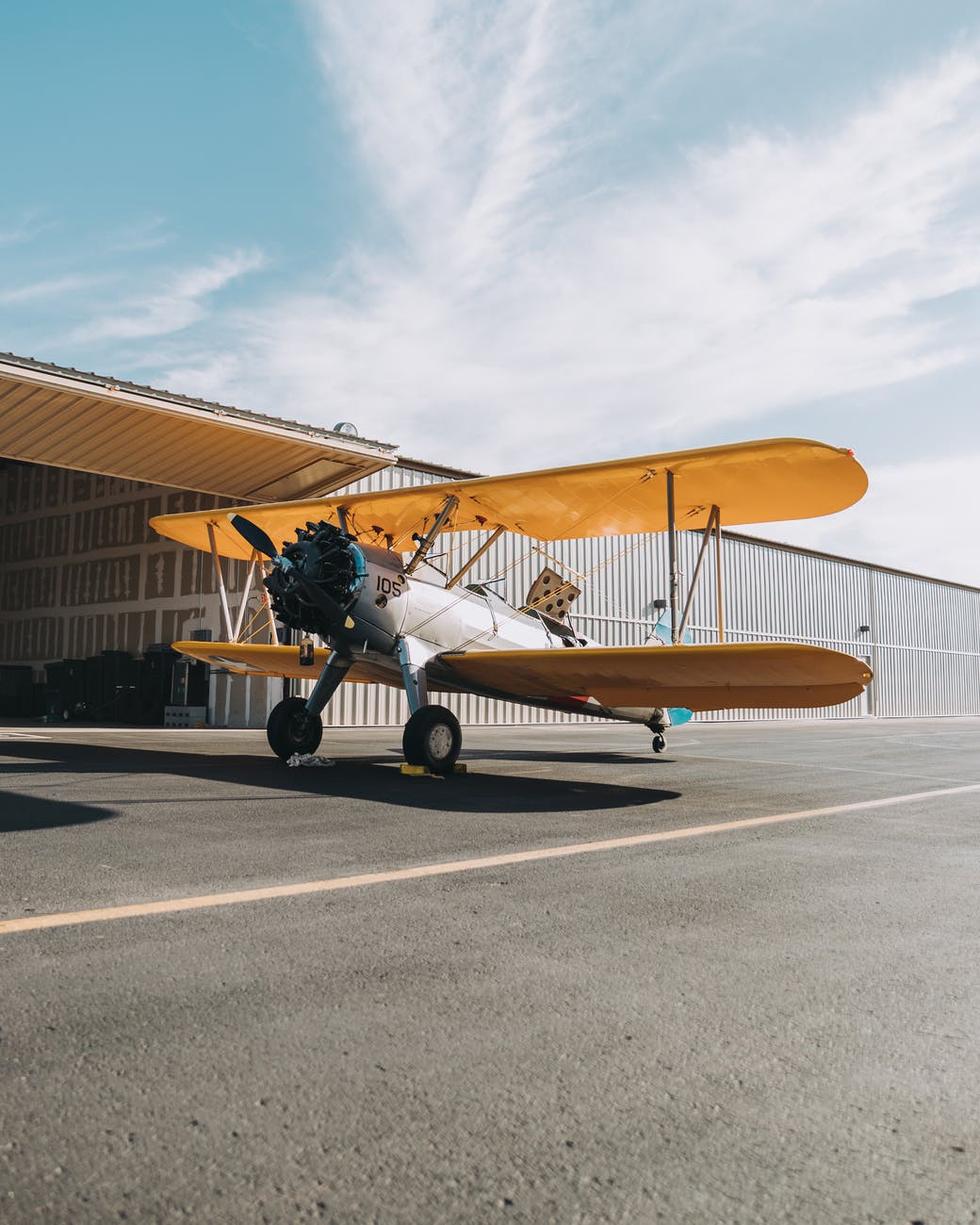 crop duster on runway in daytime