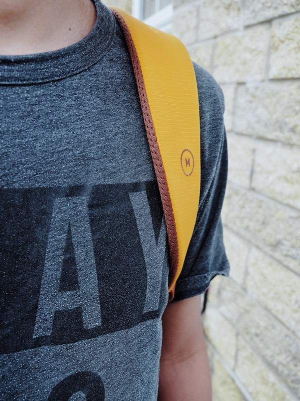 The Everything Backpack padded shoulder strap with minimal Moment logo
