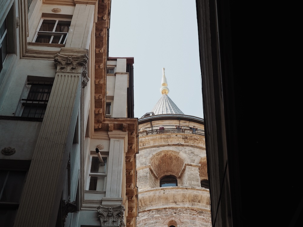 A view of the Galata Tower from the cobbled stoned streets leading to the Kamondo Steps
