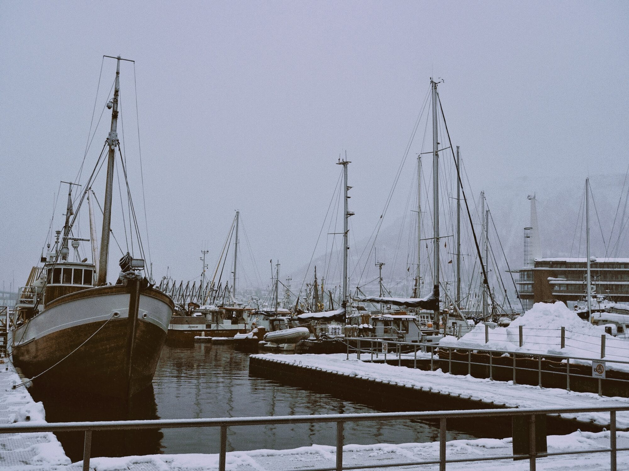 Schooners, tug boats and fishing trawlers in Tromso harbour.